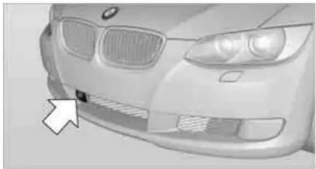 Front view of a car with visible grille and side stripes (no text or symbols)