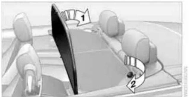 Diagram showing a car interior with labeled parts and directional arrows, likely illustrating a motion or navigation system.