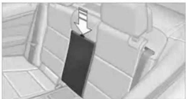 Interior view of a car seatbelt with a black belt hanging from the side (no text or symbols visible)