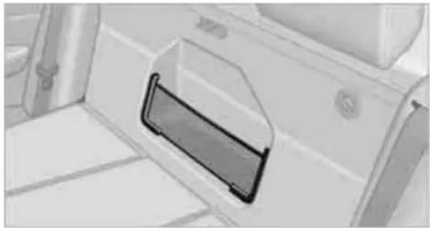 Close-up of a white plastic door with a black handle, mounted on a tiled surface (no visible text or symbols)