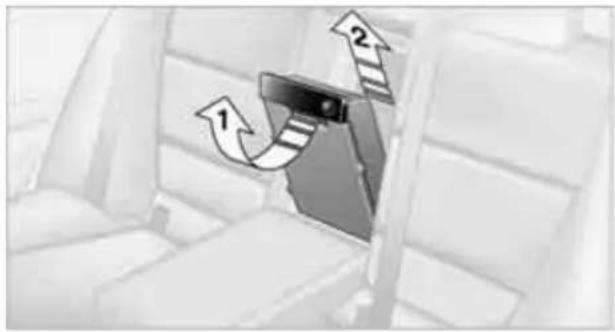 Interior view of a car seatbelt with directional arrows indicating movement (no text or symbols)