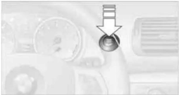 Close-up of a mechanical component with a downward arrow and screw head (no visible text or symbols)