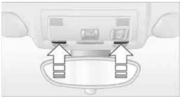 Diagram of a car interior showing two directional arrows pointing to a vehicle rear panel (no text or symbols present)