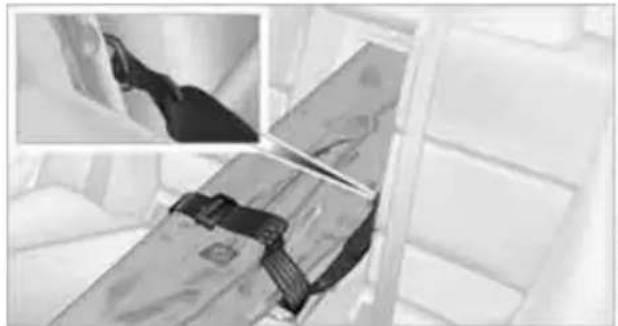 Interior view of a vehicle showing a seatbelt and dashboard, with two inset photos of the seat (no visible text or symbols)