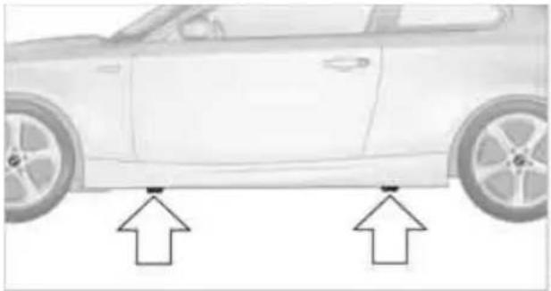 Side view of a car with two arrows pointing to the front side (no text or symbols present)