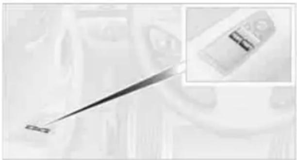 Close-up of a medical or laboratory instrument with a metallic rod, showing no visible text or symbols.