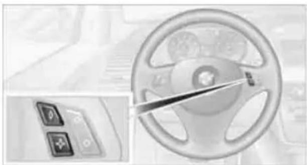 Interior view of a car dashboard with steering wheel and control panel (no visible text or symbols)