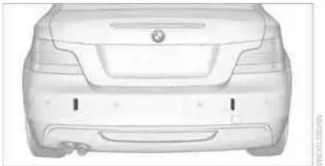 Front view of a white car with visible grille and side brackets (no text or symbols)