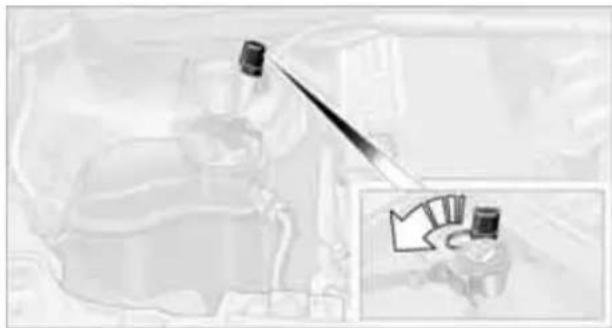 Mechanical assembly diagram showing a tool interacting with a component, with an inset view of a mechanical component (no text or symbols visible)