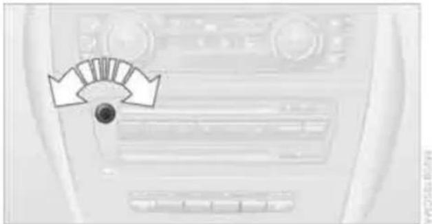 Interior view of a car dashboard with directional arrows indicating airflow or movement (no text or symbols)