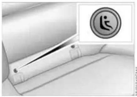 Interior view of a vehicle seatbelt with a circular warning symbol (no text or labels)