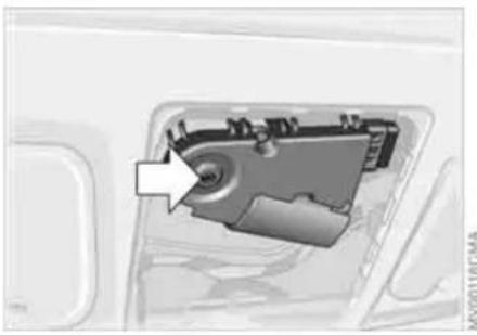 Close-up of a mechanical component with an arrow pointing to a circular feature, no visible text or symbols.