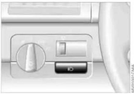 Close-up of a car air conditioner control panel with no visible text or symbols on the button or background