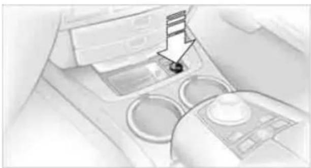 Interior view of a car dashboard with a hand cursor pointing to the left side (no visible text or symbols)