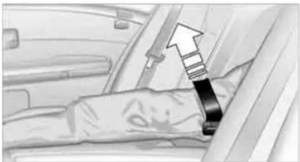 Close-up of a car's seatbelt with a black clip inserted, showing no text or symbols