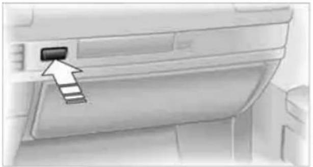 Interior view of a car air vent with a black button and arrow pointing to the vent (no text or symbols visible)