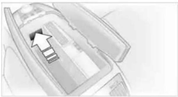 Diagram of a vehicle interior with an arrow indicating direction (no text or symbols present)