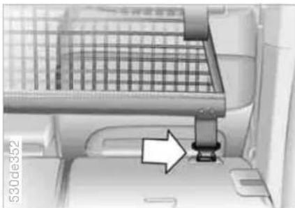 Interior view of a vehicle showing a seatbelt and dashboard with a white arrow pointing to the seat (no text or symbols visible)