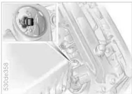 Technical illustration of a mechanical component with a magnified inset showing internal features (no text or symbols)