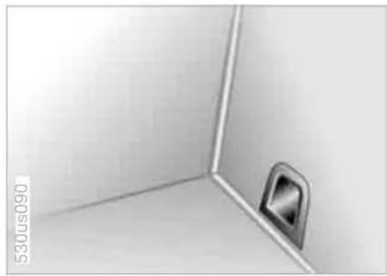 Close-up of a corner wall corner with a metallic fixture and a circular opening (no text or symbols visible)