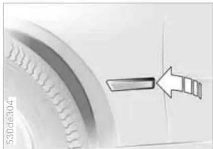 Close-up of a tire with an arrow pointing to it, no visible text or symbols