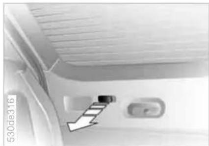 Interior view of a vehicle showing a door, seatbelt, and window (no visible text or symbols)