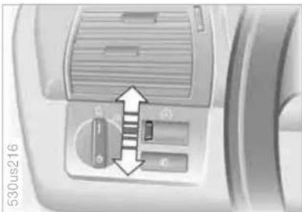 Close-up of a computer control panel with directional arrows indicating movement or adjustment (no text or symbols visible)