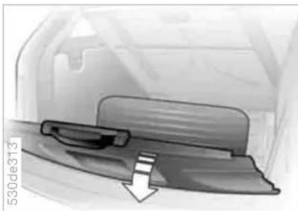 Close-up of a car door handle and seat with a downward arrow indicating motion (no text or symbols)