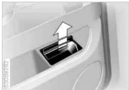 Close-up of a mechanical component with an arrow indicating upward motion (no text or symbols visible)