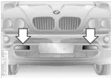 Front view of a car with two arrows pointing to the front grille (no text or symbols visible)