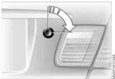 Diagram showing a car interior with a curved arrow indicating direction and text labels, possibly illustrating a vehicle or system.
