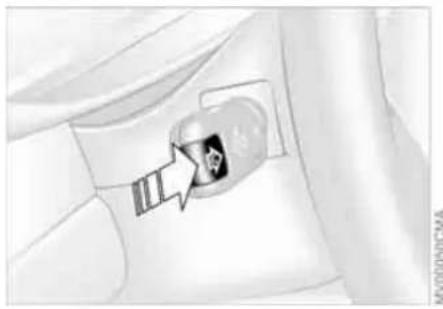 Medical illustration showing a surgical instrument inserted into a device (no text or symbols present)
