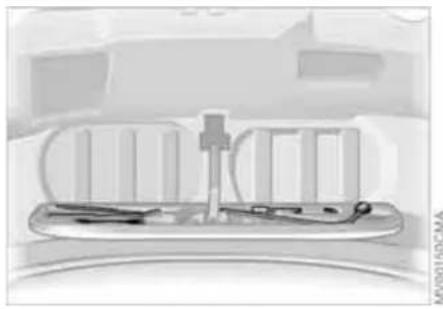 Medical device with surgical tools and a central connector (no visible text or symbols)