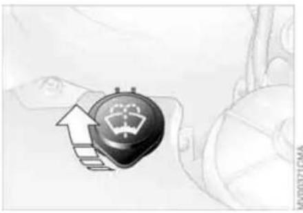 Illustration of a steering wheel with an upward arrow and motion indicator (no text or symbols)