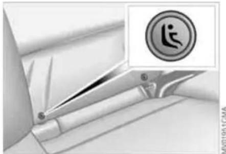 Close-up of a mechanical component with a circular warning symbol and a crosshair icon (no readable text or symbols)