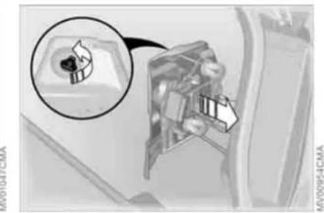 Close-up of a car interior showing a mechanical component with a magnified inset (no visible text or symbols)