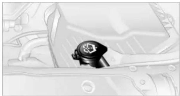 Close-up of a car's engine compartment showing the intake manifold and dashboard (no text or symbols visible)