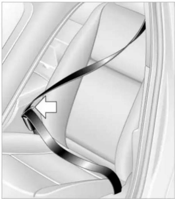 Close-up of a car seatbelt buckle with a white arrow pointing to the belt (no text or symbols visible)