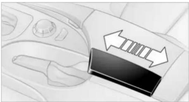 Close-up of a car dashboard with directional arrows indicating motion or flow (no text or symbols)