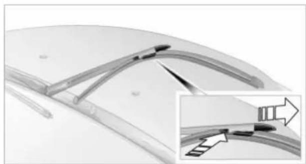 Close-up of a curved mechanical component with internal brackets and a magnified inset showing a detail (no text or symbols)