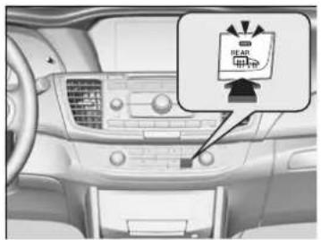 Car interior control panel with indicator lights and a warning sign showing 'HEAR' and '充电'