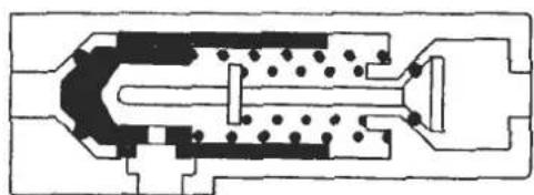 Cross-sectional diagram of a mechanical or electrical component with internal channels and dot patterns (no text or symbols)
