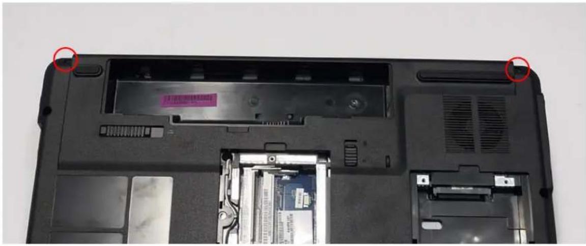 Laptop back with visible internal components and two red-circled annotations (no readable text or symbols)