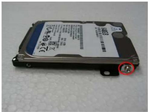 Device photo showing a hard disk with visible label and mounting bracket, marked with a red circle highlighting a specific component.