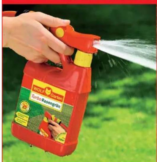 Hand spraying water from a red WOLF Garten Turbo Rasengrün spray bottle against a green grass background (no text or symbols on the spray itself)