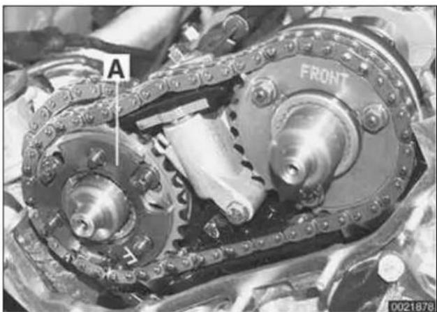 Close-up mechanical assembly showing two interlocking gears with labeled components (A and FRONT), no readable text or symbols beyond labels.