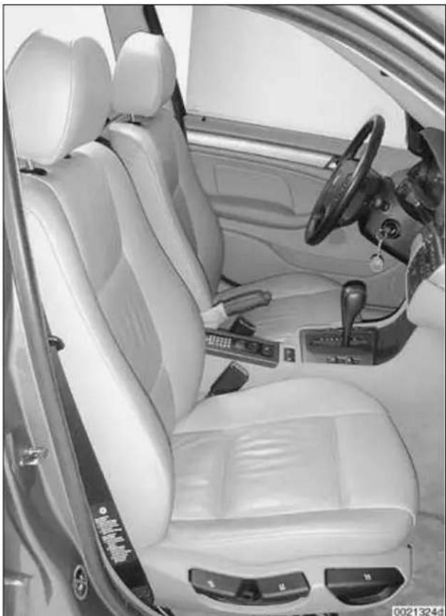 Interior view of a car showing white leather seats, steering wheel, and dashboard (no visible text or symbols).