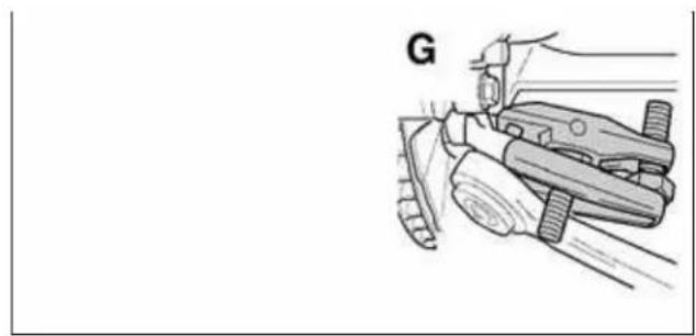 Illustration of a hand using a tool to cut or mark a piece of material, labeled 'G', no text or symbols on the diagram itself.