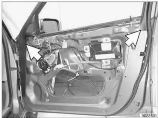 Interior view of a car showing internal components and wiring, with no visible text or symbols.