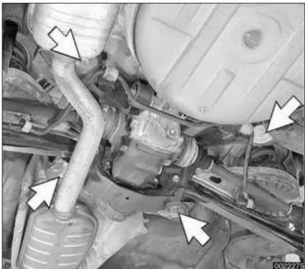 Close-up of a car engine bay with visible hoses and components, no text or symbols present